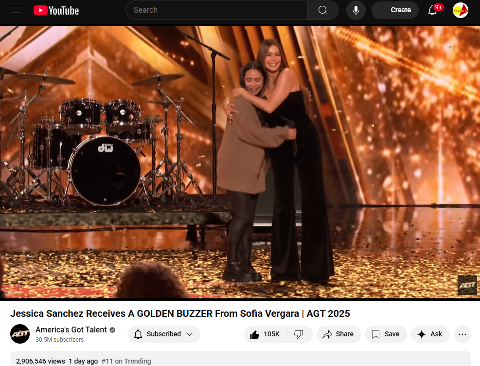 Jessica Sanchez receives a Golden Buzzer from Sofia Vergara on stage at America's Got Talent, celebrating her powerful performance amidst a backdrop of confetti and band equipment.